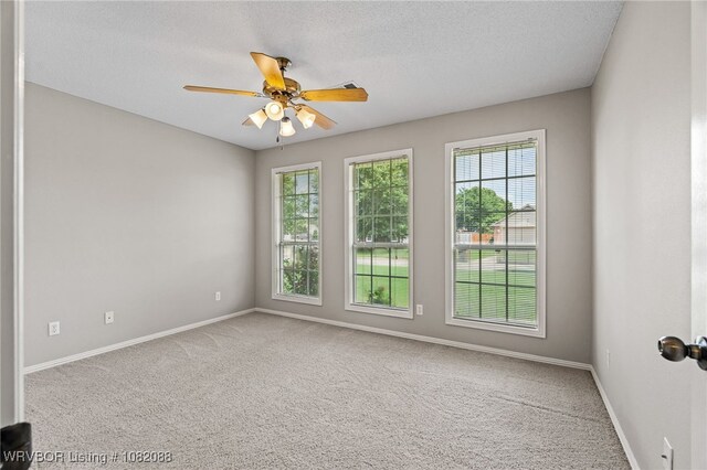 2419 Shealei Cir, Alma, AR 72921 - empty room with carpet, ceiling fan, and a textured ceiling