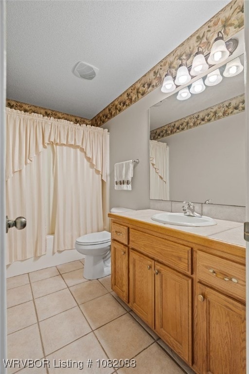 2419 Shealei Cir, Alma, AR 72921 - bathroom with tile patterned floors, vanity, shower / bath combo with shower curtain, and a textured ceiling