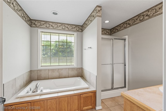 2419 Shealei Cir, Alma, AR 72921 - bathroom with a stall shower, a garden tub, tile patterned flooring, and vanity