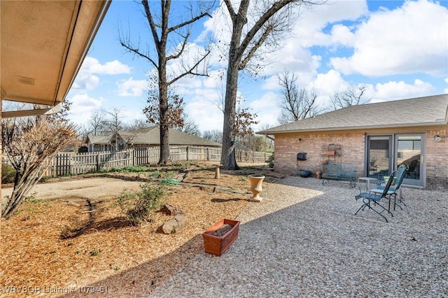 view of yard with a patio and a fenced backyard