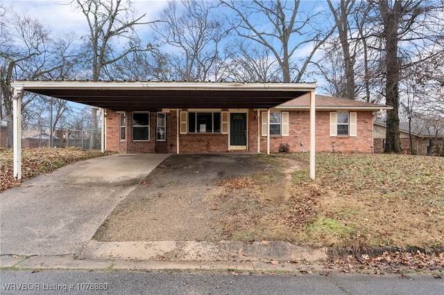 single story home with a carport