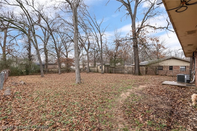 view of yard with central AC