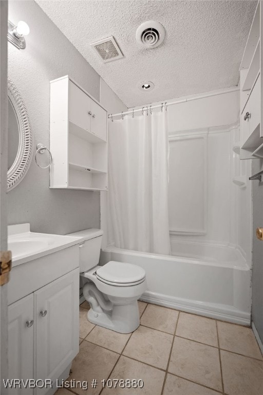 full bathroom featuring tile patterned floors, toilet, shower / tub combo, a textured ceiling, and vanity