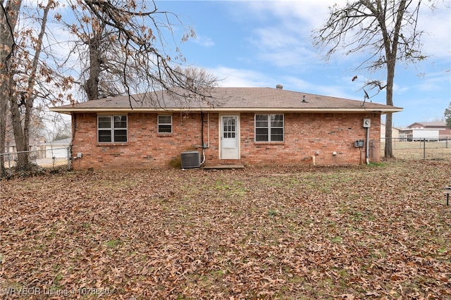 back of property featuring central AC unit