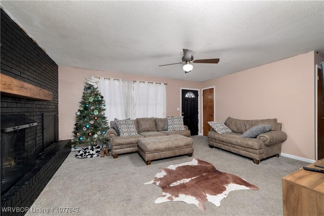 living room with carpet, a textured ceiling, and a brick fireplace