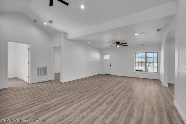 unfurnished living room with ceiling fan, visible vents, and light wood finished floors