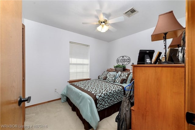 bedroom featuring light carpet and ceiling fan