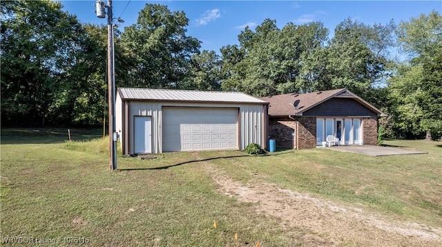 garage with a yard