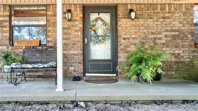 doorway to property featuring covered porch