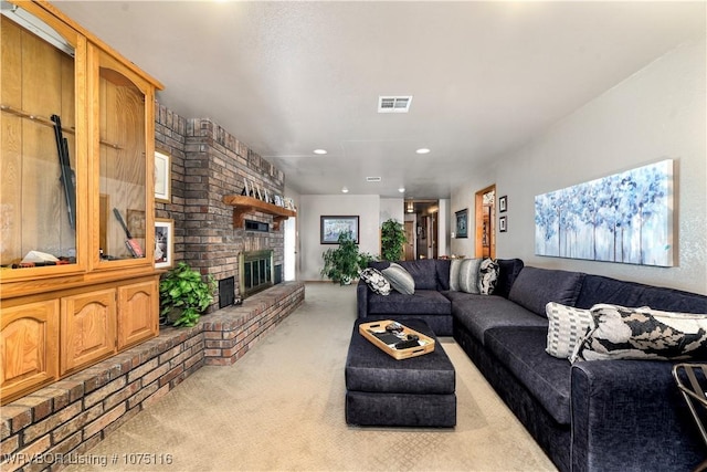 living room with light carpet and a fireplace