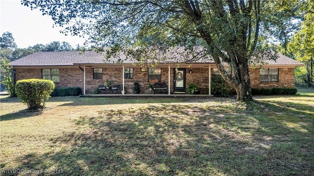 ranch-style house featuring a front lawn