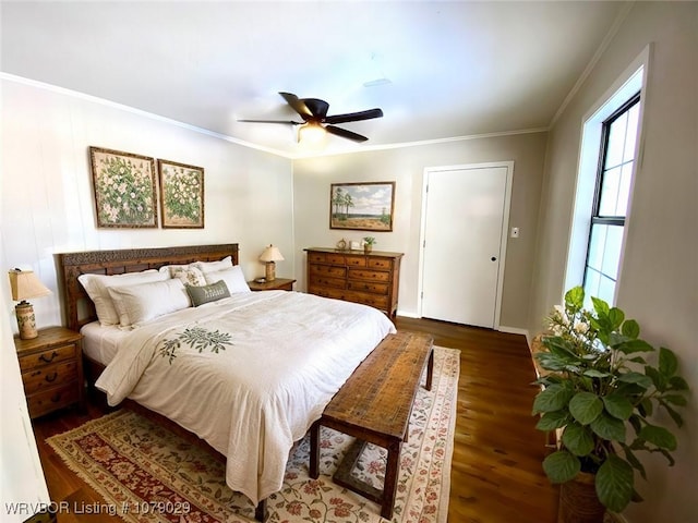 bedroom featuring ceiling fan, dark wood-type flooring, and ornamental molding