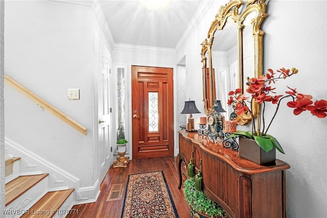 foyer with ornamental molding and dark wood-type flooring