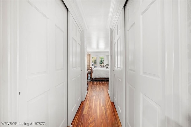 hall with hardwood / wood-style flooring