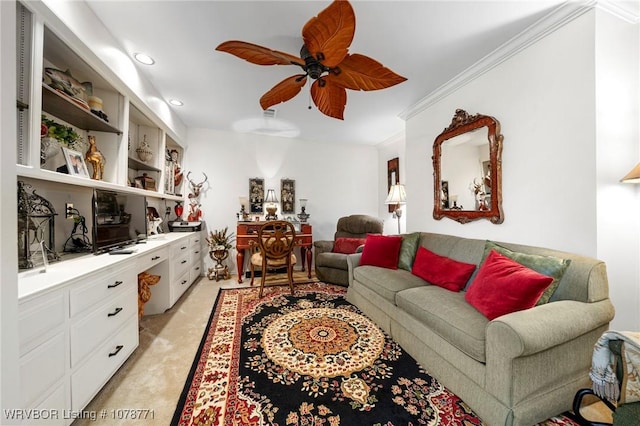 living room with light carpet, built in desk, ornamental molding, and ceiling fan