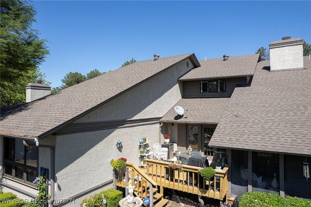 rear view of property with a deck