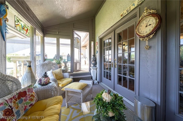 sunroom featuring lofted ceiling