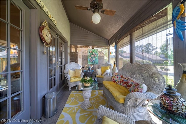 sunroom featuring vaulted ceiling and ceiling fan