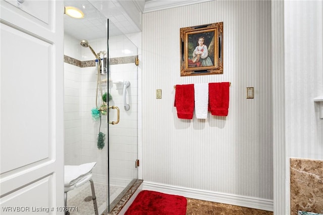 bathroom featuring a shower with shower door