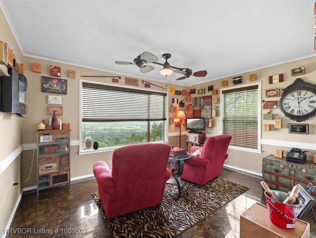 living area with a ceiling fan, ornamental molding, and baseboards