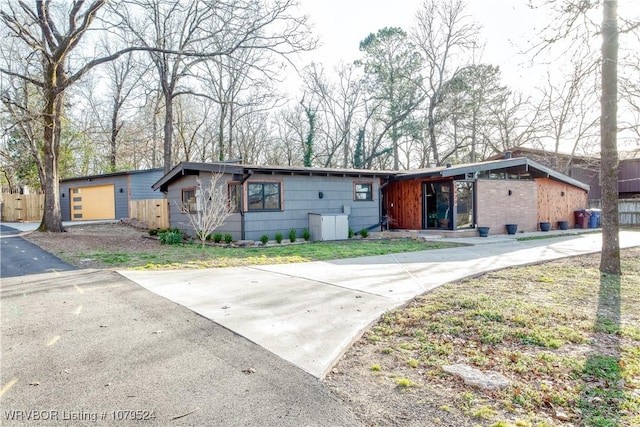 mid-century inspired home with fence