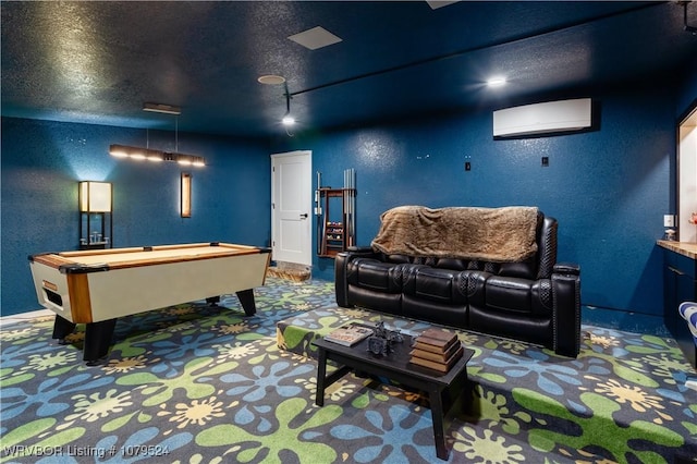 game room with a textured wall, a textured ceiling, carpet flooring, and a wall mounted AC