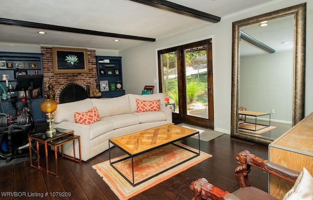 living area with crown molding, a fireplace, dark wood finished floors, and beamed ceiling