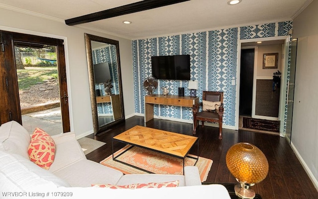 living area with crown molding, baseboards, and wallpapered walls