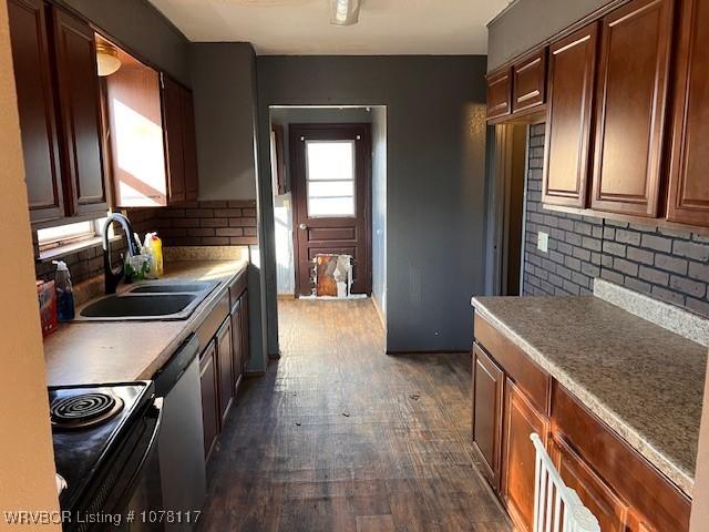 kitchen with dishwasher, sink, electric range, decorative backsplash, and dark hardwood / wood-style floors