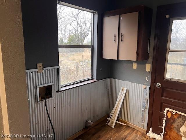 laundry area with hardwood / wood-style flooring