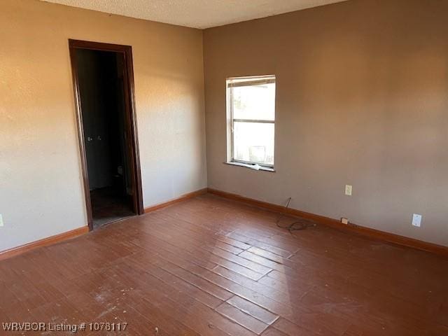 unfurnished room featuring wood-type flooring