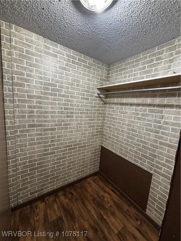 walk in closet featuring dark hardwood / wood-style floors