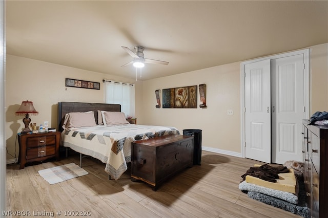 bedroom with light hardwood / wood-style floors and ceiling fan