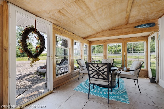 sunroom / solarium featuring lofted ceiling and wood ceiling