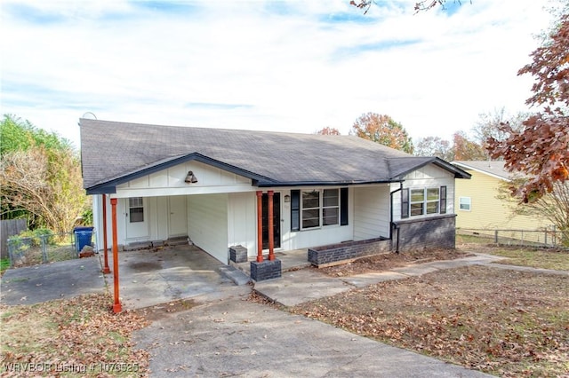 ranch-style house featuring a carport