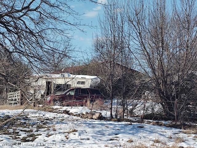 view of yard layered in snow