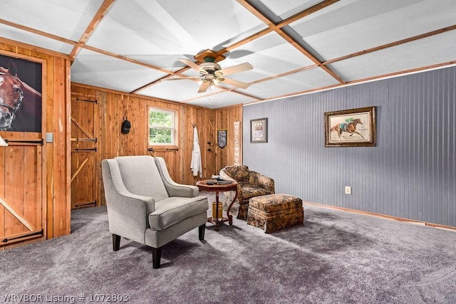 living area with carpet and ceiling fan