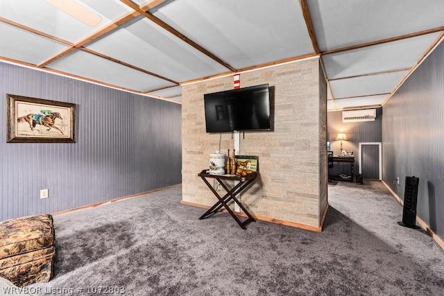 living room featuring an AC wall unit, beamed ceiling, and carpet floors