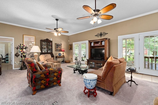 carpeted living room featuring crown molding, french doors, ceiling fan, and a textured ceiling