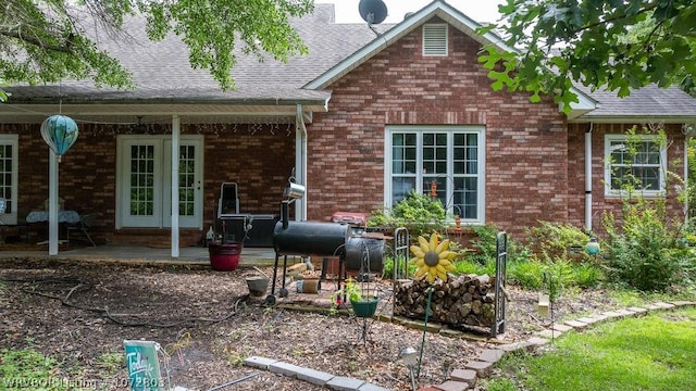 rear view of property featuring a patio area