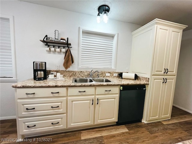 kitchen with dark wood-type flooring, dishwasher, and sink