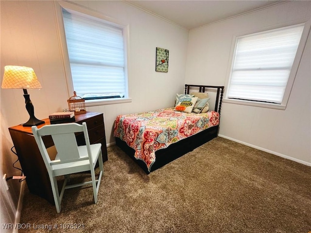 bedroom featuring dark carpet and crown molding