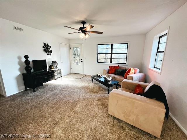 living room with carpet floors and ceiling fan