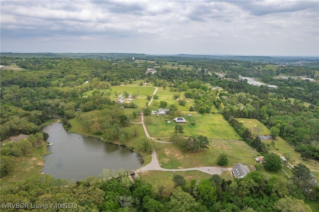 birds eye view of property featuring a water view and a view of trees