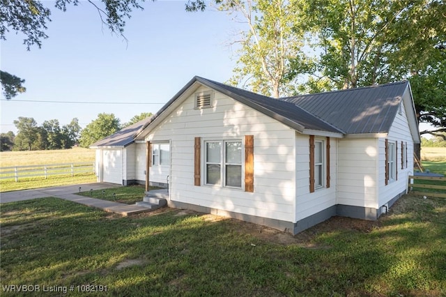 106595 S 4770th Rd, Muldrow, OK 74948 - view of side of property featuring a metal roof and a garage