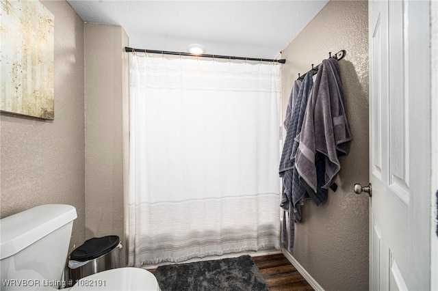 106595 S 4770th Rd, Muldrow, OK 74948 - full bath with a textured wall, wood finished floors, and curtained shower