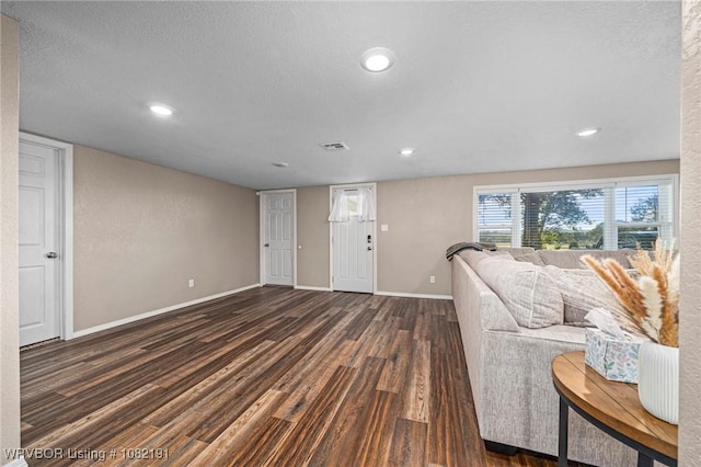 106595 S 4770th Rd, Muldrow, OK 74948 - living area with dark wood finished floors, recessed lighting, and a textured ceiling