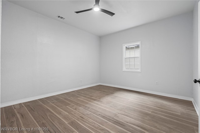 618 Sycamore St, Van Buren, AR 72956 - empty room with a ceiling fan, wood finished floors, and baseboards