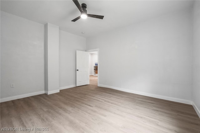 618 Sycamore St, Van Buren, AR 72956 - spare room with a ceiling fan, wood finished floors, and baseboards