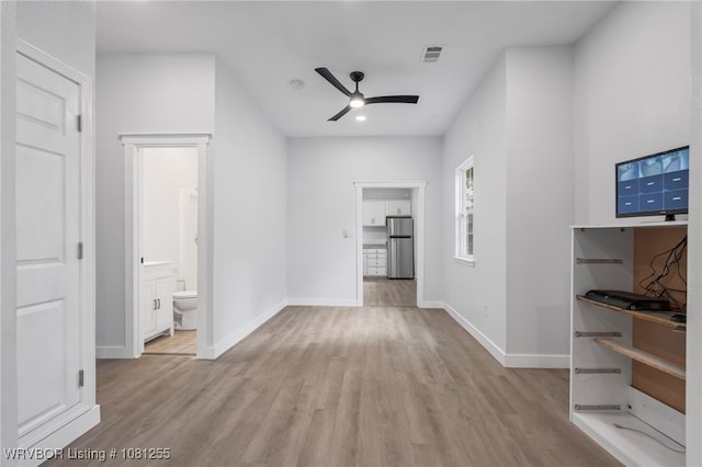 618 Sycamore St, Van Buren, AR 72956 - unfurnished living room with a ceiling fan, wood finished floors, and baseboards
